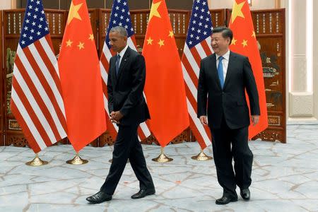 Chinese President Xi Jinping and U.S. President Barack Obama walk during their meeting at the West Lake State Guest House in Hangzhou, Zhejiang province, China, September 3, 2016. REUTERS/Wang Zhao/Pool