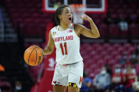 Maryland guard Katie Benzan talks to teammates while working the floor against Purdue during the first half of an NCAA college basketball game, Wednesday, Dec. 8, 2021, in College Park, Md. (AP Photo/Julio Cortez)