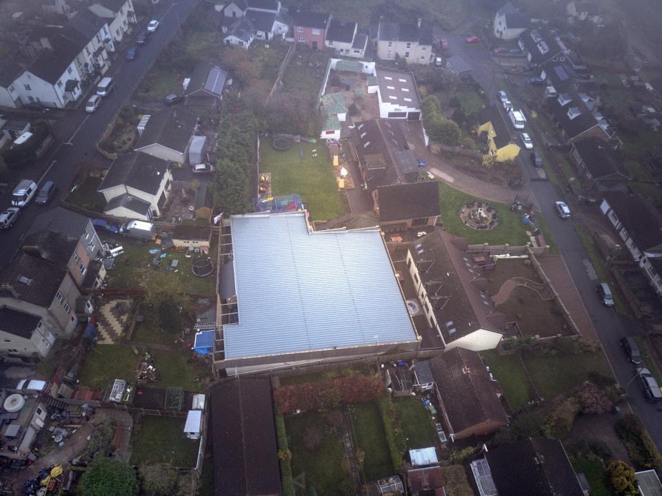 Aerial view of the vast 'man cave' built by Graham Wildin in his back garden - without planning permission. See SWNS story SWBRcave; A man ordered to knock down 'Britain's best man cave' which he built illegally in his back garden has been told to pay Â£30,000 to the council to cover its prosecution costs. Graham Wildin, 66, spent four years battling with authorities over the private leisure complex. It contains a bowling alley, cinema, casino and a gym - and pictures from Google Earth show it looking like a massive factory. But a High Court judge said the granddad-of-five must comply with the council and remove the centre.