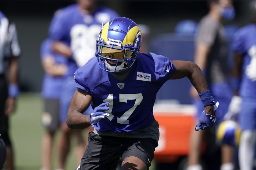 Los Angeles Rams wide receiver Robert Woods runs during an NFL football camp practice.