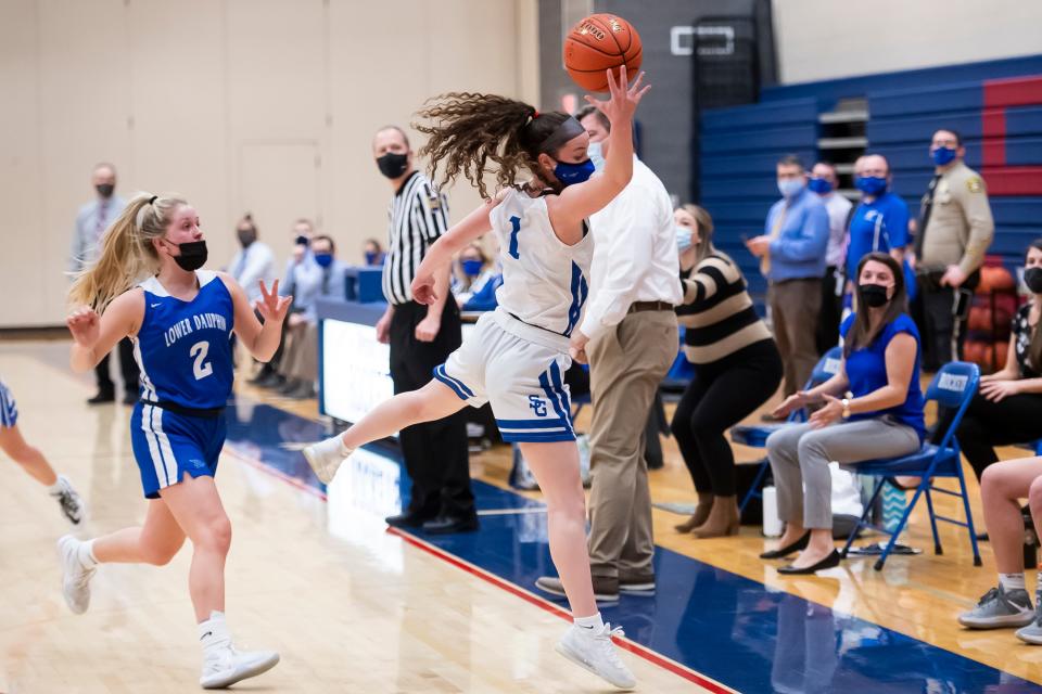 Spring Grove's Leah Kale leaps in the air to keep a pass in bounds against Lower Dauphin in a PIAA District 3 Class 5A semifinal game at Spring Grove Area High School on Wednesday, March 10, 2021.