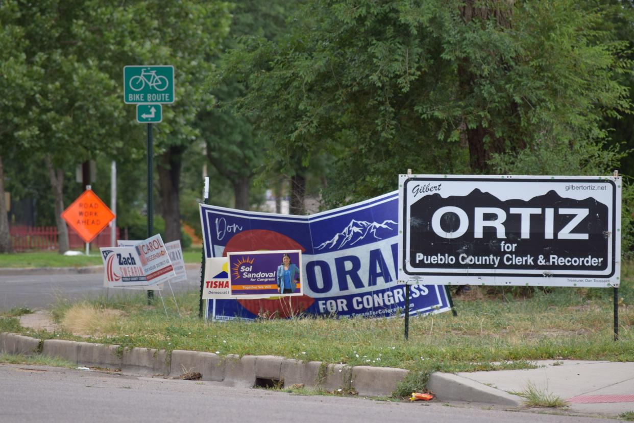 Signs for Pueblo County political candidates line Abriendo Avenue near the intersection of Abriendo and Idaho Avenue on Tuesday.