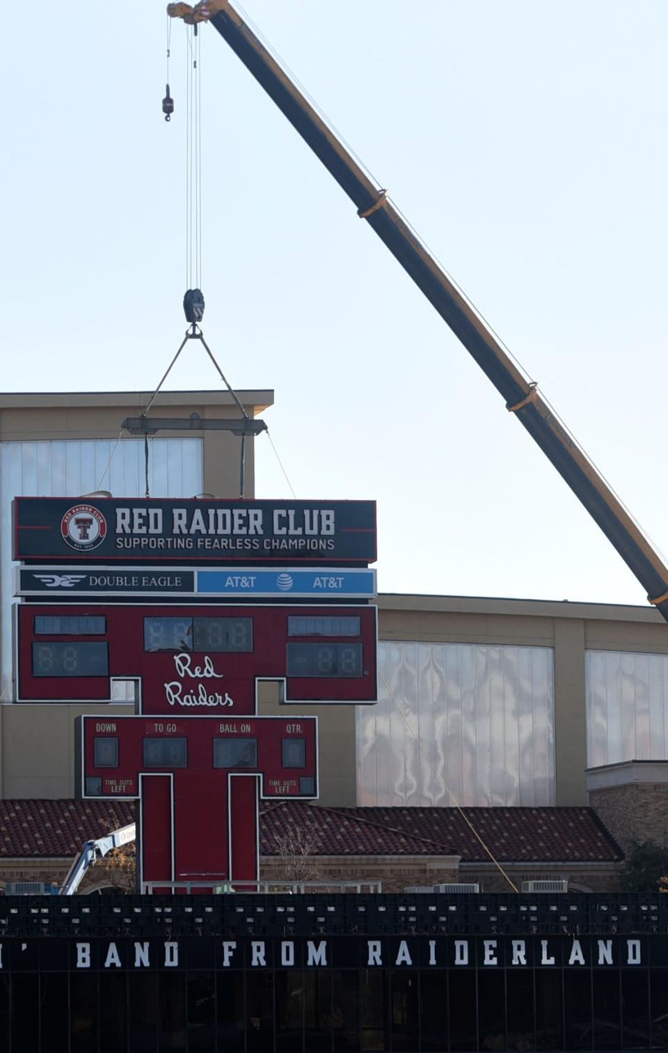 The Double T scoreboard, overlooking the south end zone at Jones AT&T Stadium since June 1978, was removed on Thursday night. The 28,500-pound structure was successfully hoisted by crane and put onto a flatbed to be driven offsite.