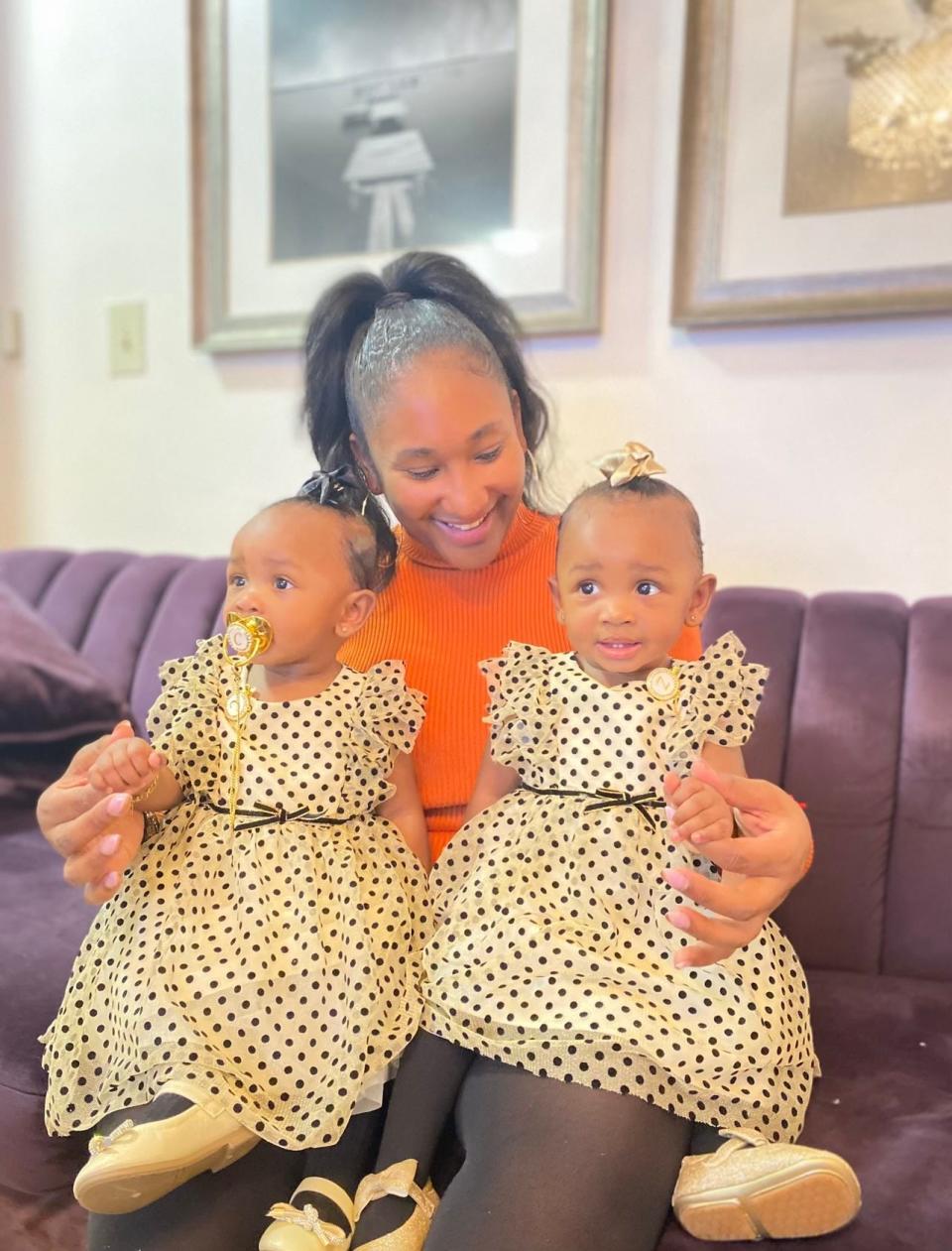 Suleyka Basil, here with her twins, is a Uniqlo store manager in New York. The Fast Retailing brand gives management-track employees a monthly $1,000 stipend for child care for up to three years.