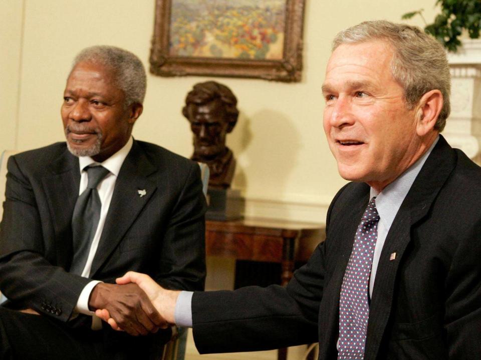 Annan agreed to work together with George W Bush to help alleviate the suffering in Sudan in 2006 (Getty)