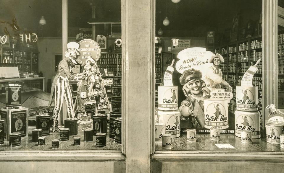Dages Paint store in Louisville advertises "pure white lead paint" in the shop window in this image from the mid-20th century.