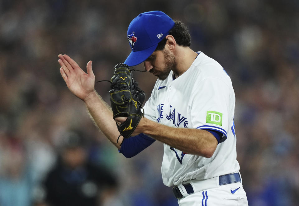 Toronto Blue Jays relief pitcher Jordan Romano celebrates the team's win over the Philadelphia Phillies in a baseball game Tuesday, Aug. 15, 2023, in Toronto. (Nathan Denette/The Canadian Press via AP)