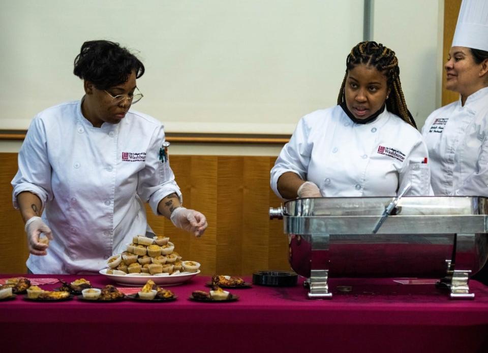 Students at Chicago's Washburne Culinary & Hospitality Institute prepare dishes for a February 2023 luncheon held at Kennedy-King College to honor a donation to the school of more than 1,700 cookbooks from local resident Sandra McWorter Marsh. Recipes for the lunch menu, which included jambalaya and barbecued chicken, were gleaned from several of Marsh's books.