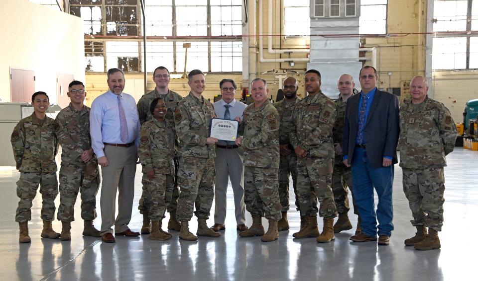 Members fro the 908th Airlift Wing, Community college of the Air Force and the Federal Aviation Administration pose for a photo, Jan. 20, 2023, before a briefing on the new FAA Airframe and Powerplant certification program developed at Maxwell Air Force Base.