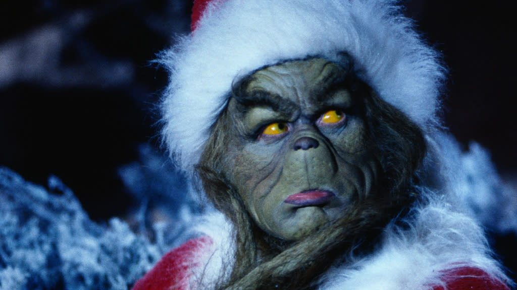 Jim Carrey gurns his way through furry prosthetics in the largely well-loved 'The Grinch', directed by Ron Howard. (Credit: Universal)