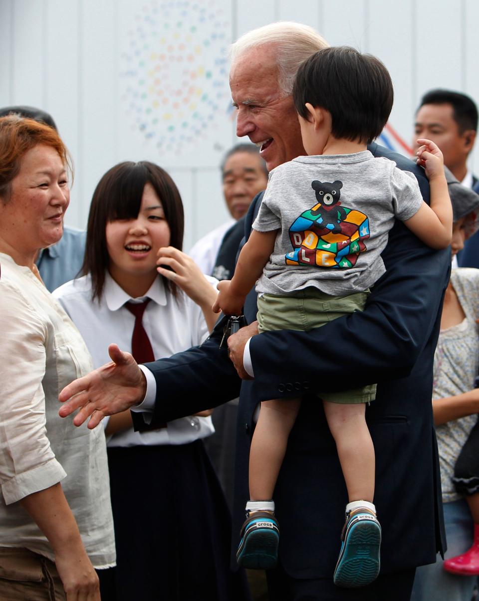 Then-Vice President Joe Biden with child survivors of March 11, 2011  earthquake and tsunami in Natori on Aug. 23, 2011.