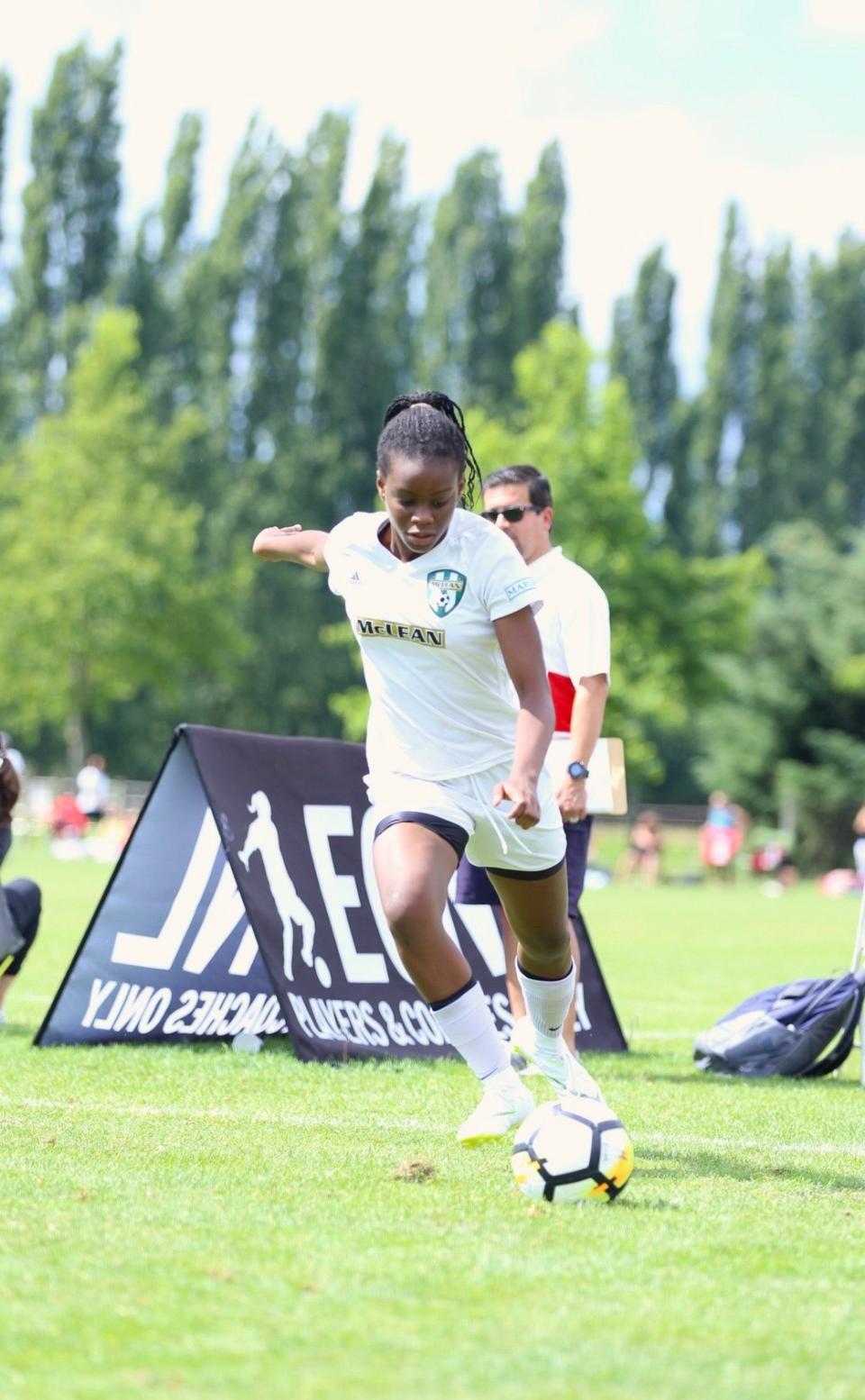 High school senior Precious Ogu playing soccer.