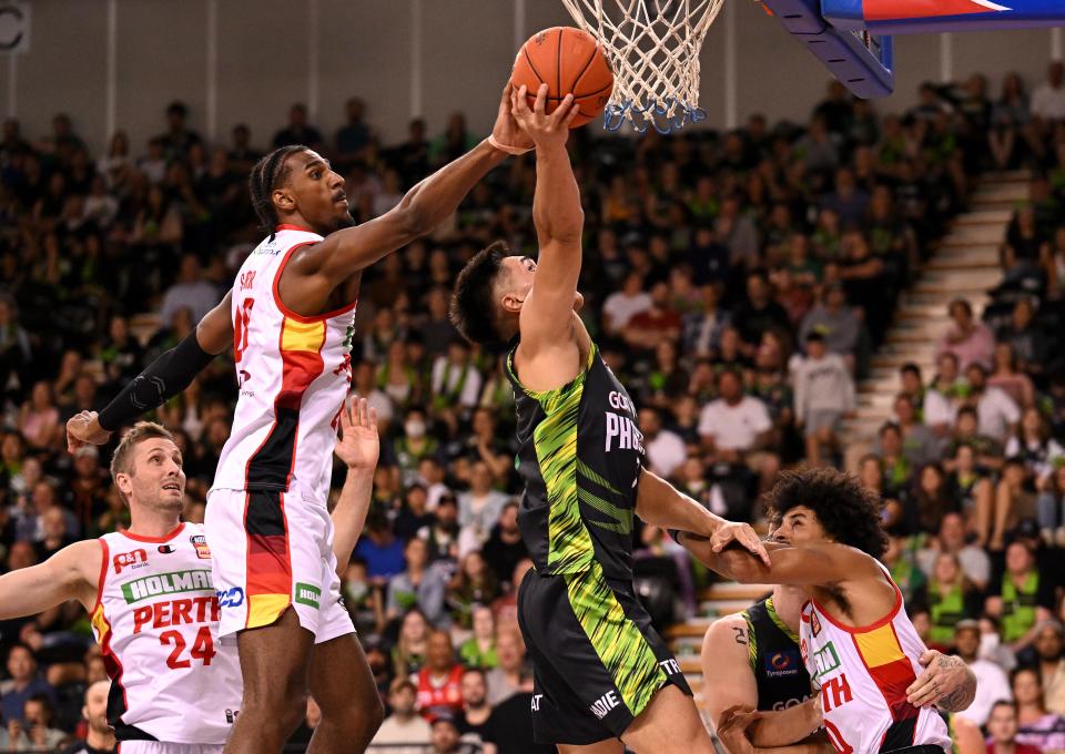 Perth Wildcats' Alexandre Sarr, left, blocks a shot during an NBL match Jan. 27, 2024, in Melbourne, Australia. Sarr, a 19-year-old 7-foot-1 big, is one of the best prospects in the 2024 draft that is underwhelming at the top.