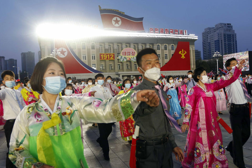 FILE - Students and youth attend a dancing party in celebration of the 110th birth anniversary of its late founder Kim Il Sung at Kim Il Sung Square in Pyongyang, North Korea on April 15, 2022. North Korea has recently reported fewer than 200 daily fever cases amid its first domestic COVID-19 outbreak and says its traditional “Koryo” herbal medicines are playing a key role in curing patients. (AP Photo/Jon Chol Jin, File)