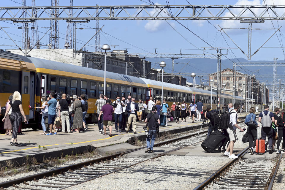 Passengers disembark from a train that arrived from the Czech Republic in Rijeka, Croatia, Wednesday, July 1, 2020. A train carrying some 500 tourists from the Czech Republic has arrived to Croatia as the country seeks to attract visitors after easing lockdown measures against the new coronavirus.(AP Photo)