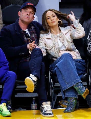 <p>Kevork Djansezian/Getty</p> Affleck and Lopez courtside on Saturday