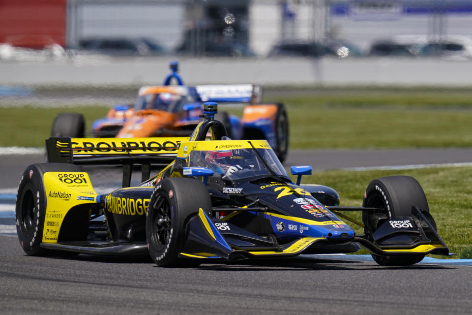 Colton Herta drives through a turn during practice for the IndyCar auto race at Indianapolis Motor Speedway in Indianapolis, Friday, May 14, 2021. (AP Photo/Michael Conroy)