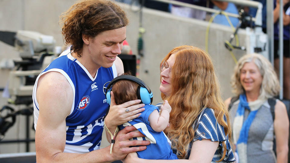 Seen here, Ben Brown, his wife Hester and their daughter Aila after a Kangaroos match.
