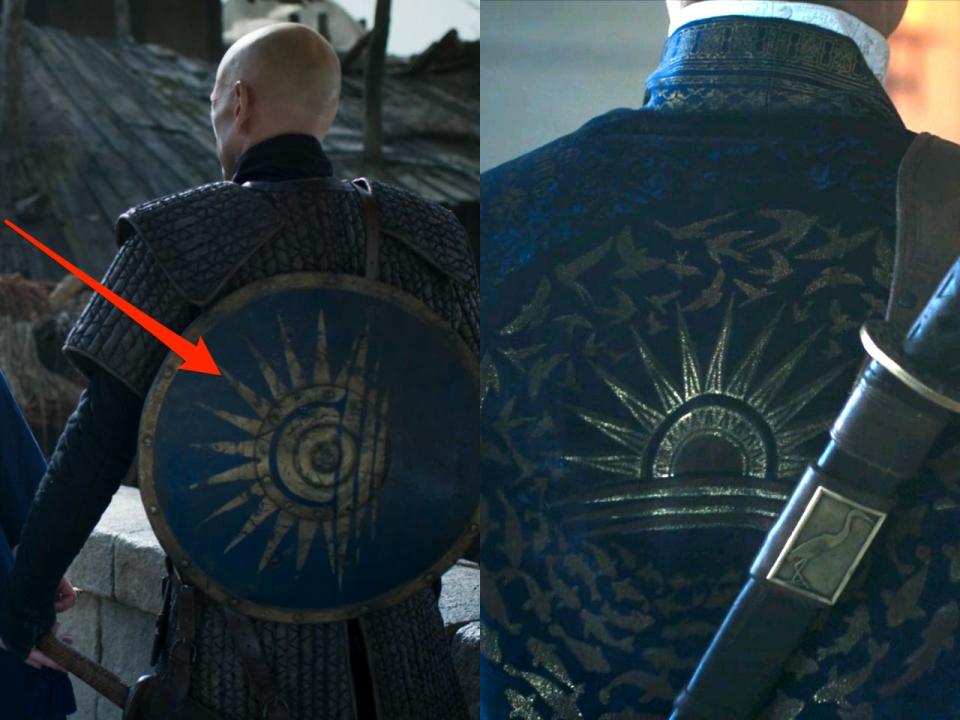 Cairhien soldier's shield side by side with Rand's robe.