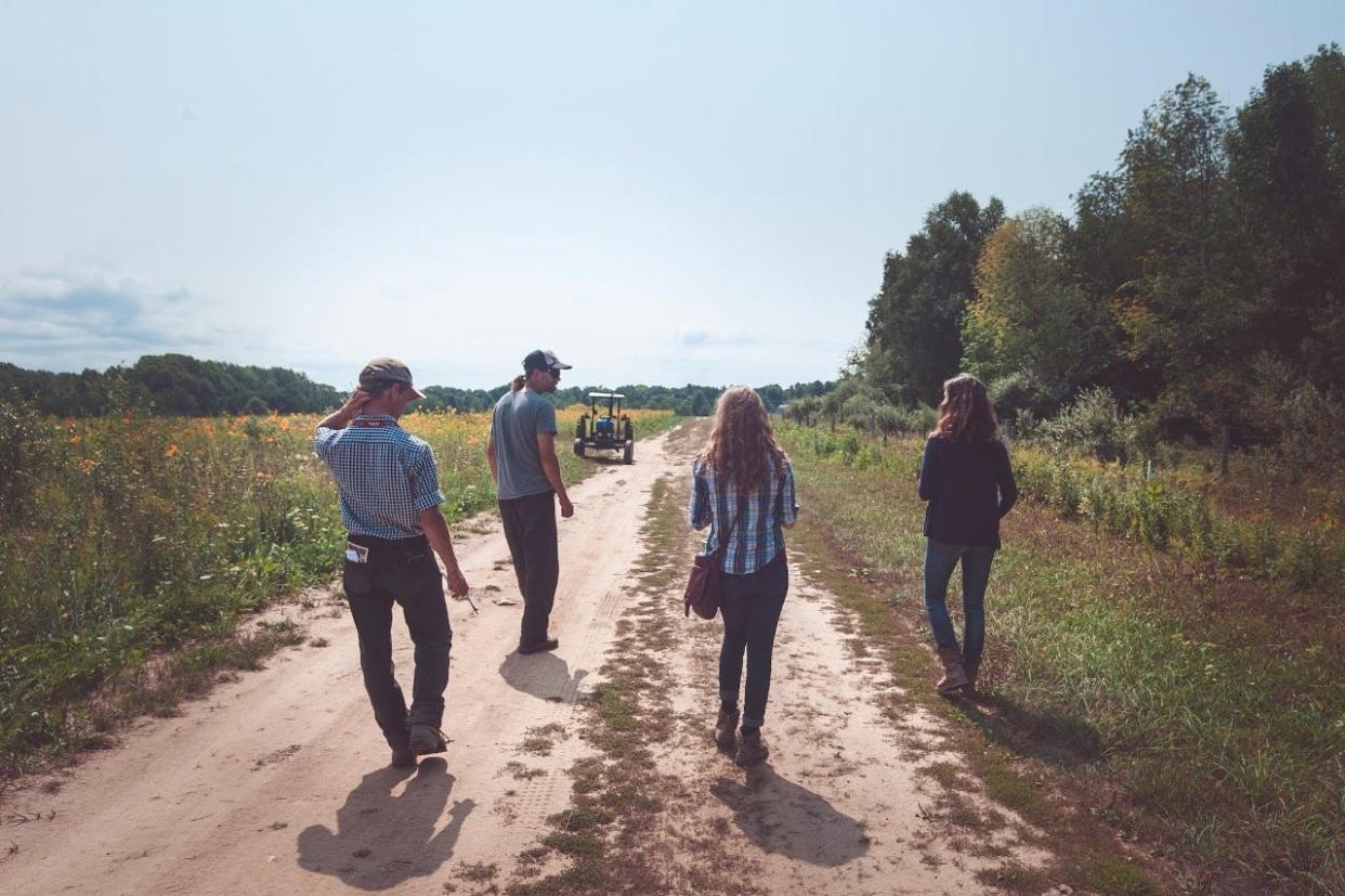 Farmers discuss land use decisions at Providence Organic Farm during Crosshatch 2018 summer field school.