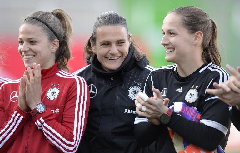 (L to R) Germany's midfielder Melanie Leupolz, goalkeeper Nadine Angerer and goalkeeper Laura Benkarth attend a training session for Germany's women's national football team in Fuerth on April 7, 2015