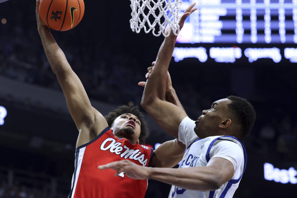 Mississippi's Jaemyn Brakefield shoots against Kentucky's Ugonna Onyenso during the second half of an NCAA college basketball game Tuesday, Feb. 13, 2024, in Lexington, Ky. (AP Photo/James Crisp)