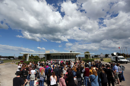 People gather to pray for the 44 crew members of the missing at sea ARA San Juan submarine, at the entrance of an Argentine Naval Base in Mar del Plata, Argentina November 22, 2017. REUTERS/Marcos Brindicci