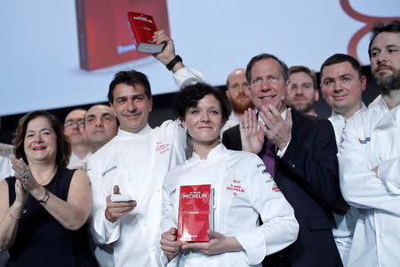 French chef Yannick Alleno (2ndL) poses with chef Fanny Rey (C) after been awarded with three Michelin stars for his Alpine restaurant Le 1947 in the ski resort Courchevel, making him a six-star chef, in Paris, France, February 9, 2017. REUTERS/Benoit Tessier