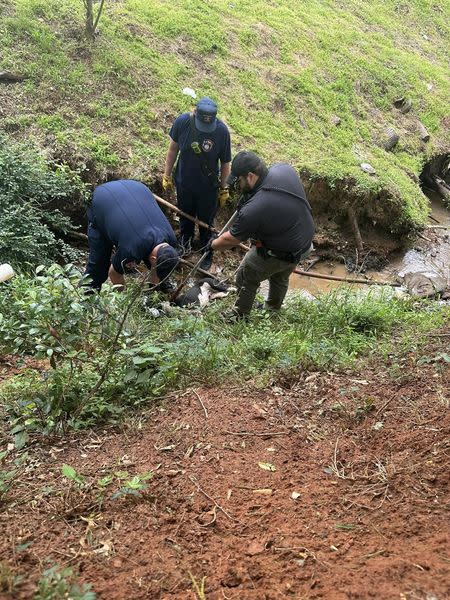 ESD2 crews retrieving the injured dog, courtesy of Smith County ESD2