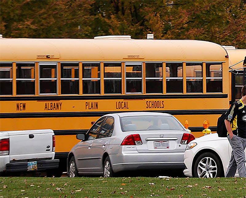 Buses from the New Albany-Plain Local Schools line up in front of New Albany High School and middle school to take students home after class, Wednesday afternoon, November 5, 2014.