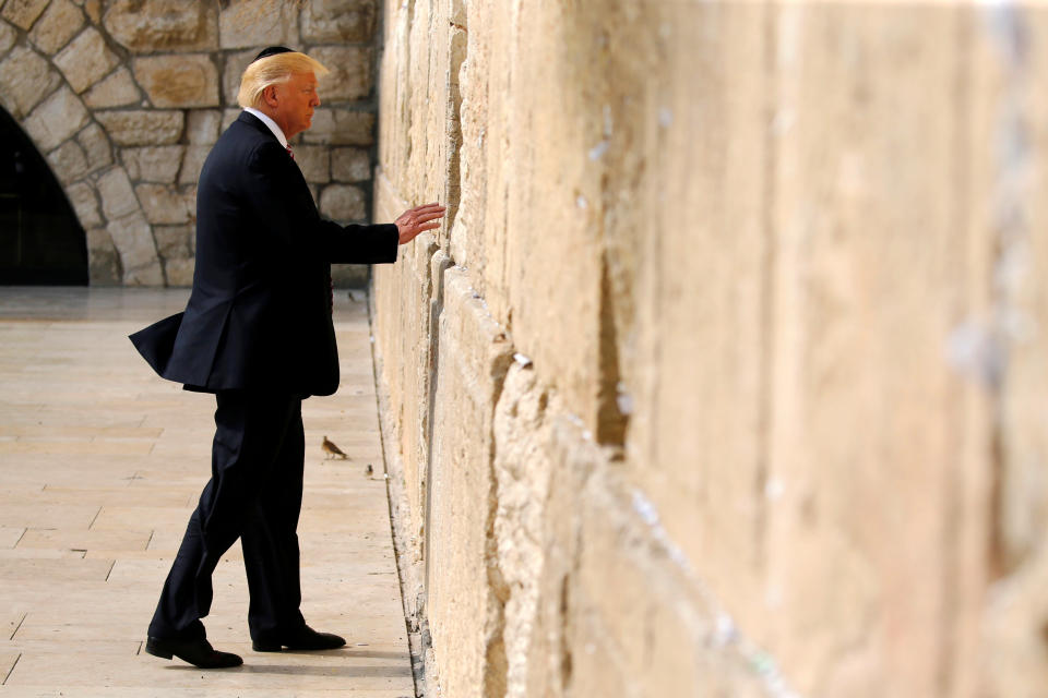 U.S. President Donald Trump prepares to leave a note at the Western Wall in Jerusalem May 22, 2017. REUTERS/Jonathan Ernst