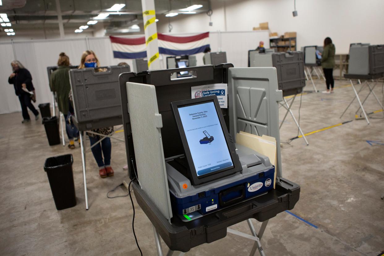 A voting machine stands empty while voters use other machines to cast their ballots during early voting at the Delaware County Board of Elections in this 2020 Dispatch file photo.