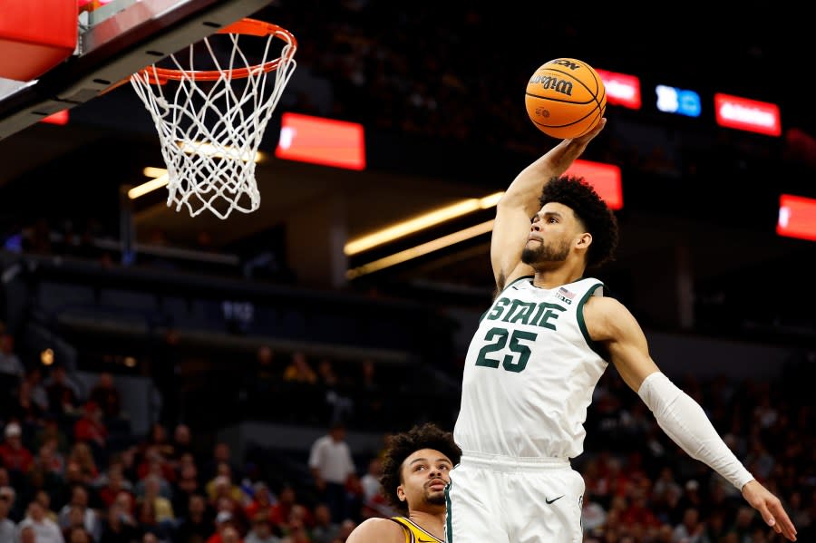 MINNEAPOLIS, MINNESOTA – MARCH 14: Malik Hall #25 of the Michigan State Spartans dunks the ball against the Minnesota Golden Gophers in the first half in the Second Round of the Big Ten Tournament at Target Center on March 14, 2024 in Minneapolis, Minnesota. (Photo by David Berding/Getty Images)