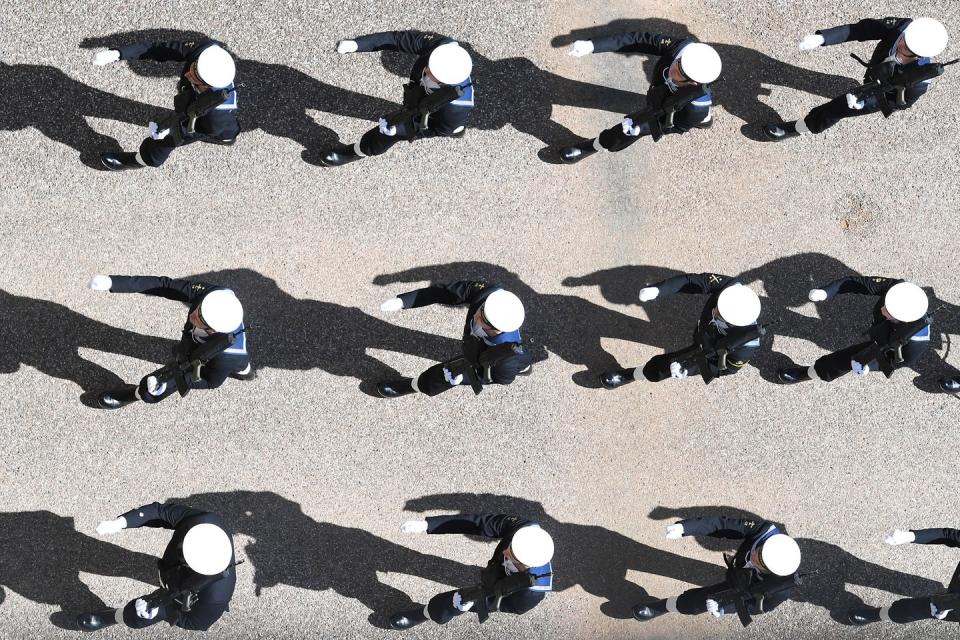 <p>Sailors in the Royal Navy participate in the military march. Prince Philip served in the British Royal Navy and fought in World War II. </p>