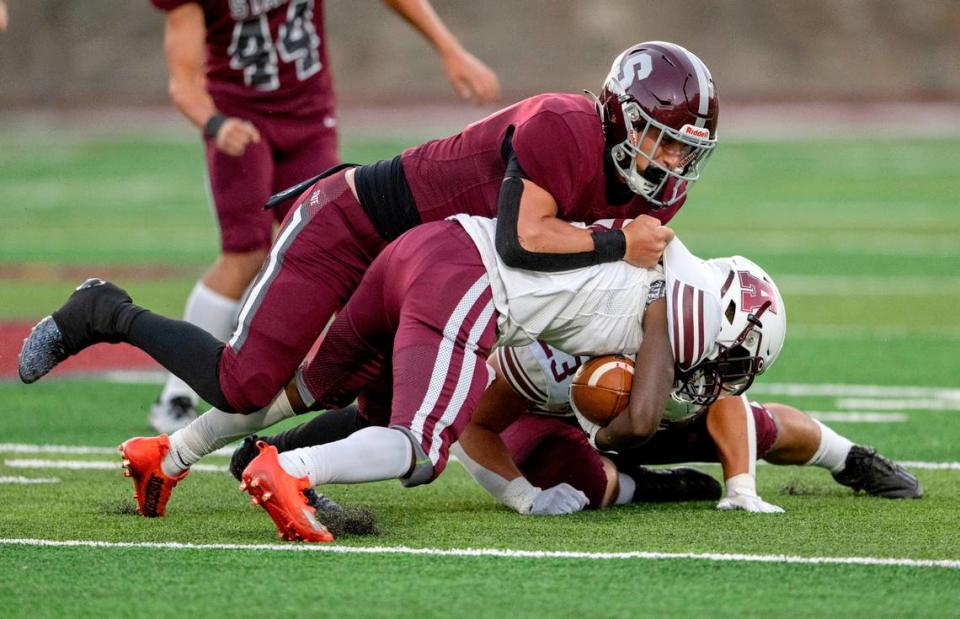 State College’s Michael Gaul tackles Altoona’s Julian Hazlewood during the game on Friday, Sept. 15, 2023.