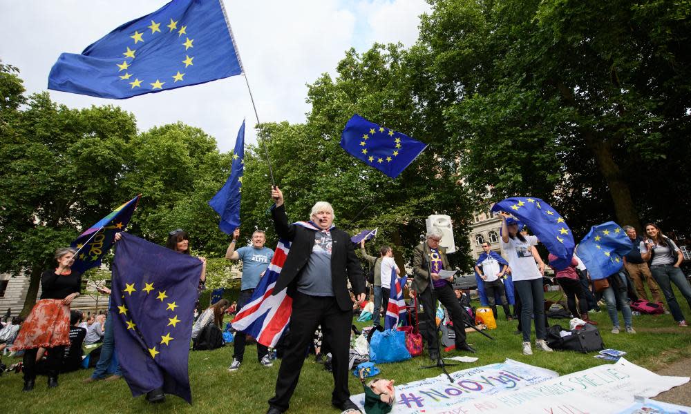 Anti-government protesters attend an event called ‘Theresa’ May’s Leaving Drinks’ in London on 30 June. 