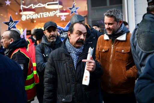 "We're getting dozens of emails from supporters every day," Philippe Martinez, centre, of France's CGT labour union said during a rally in Paris on Friday