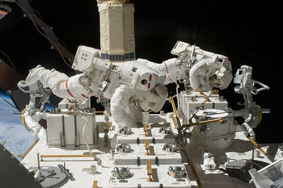 NASA astronauts Tom Marshburn and Chris Cassidy work outside the International Space Station during a spacewalk in 2009. They were paired again for a rare unplanned spacewalk on May 11, 2013.