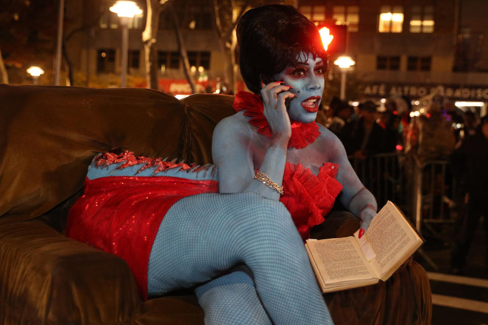 A woman dressed as the woman cut in half from the movie "Beetlejuice" poses for a photo in the 46th Annual Greenwich Village Halloween Parade. (Photo: Gordon Donovan/Yahoo News)