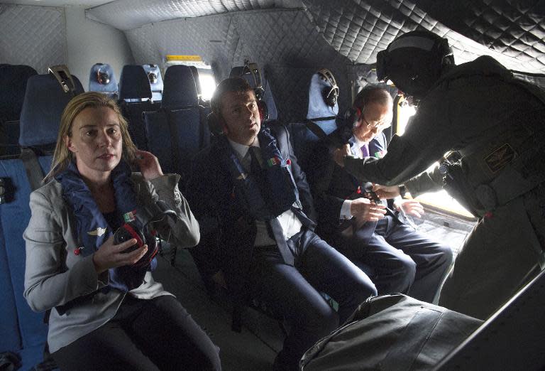 A photo made available by the Palazzo Chigi Press Office shows UN Secretary General Ban Ki-moon (R), Italian PM Matteo Renzi (C) and EU foreign policy chief Federica Mogherini (L) on April 27,2015 on board the Italian naval ship San Giusto