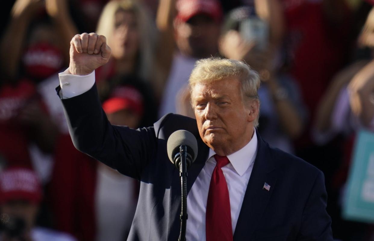 <span class="caption">Will Donald Trump win again? History suggests it's possible. The president pumps his fist after speaking at a campaign rally at Phoenix Goodyear Airport on Oct. 28, 2020, in Goodyear, Ariz. </span> <span class="attribution"><span class="source">(AP Photo/Ross D. Franklin)</span></span>