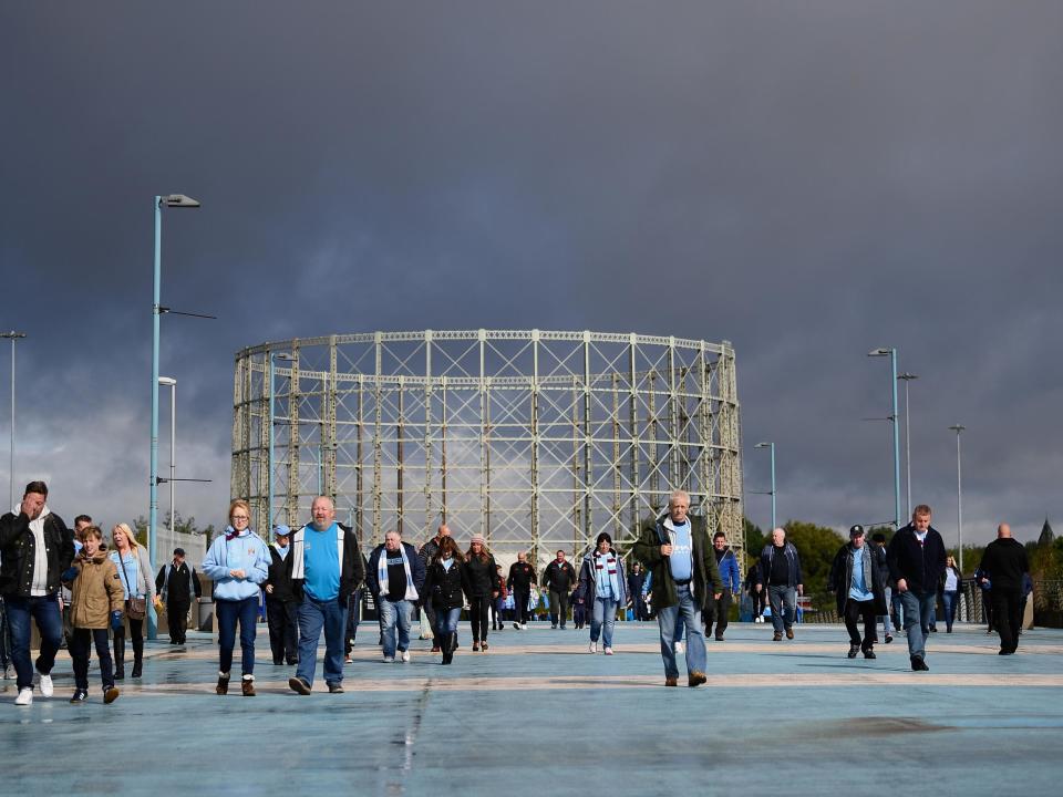 Fans make their way to the Etihad Stadium: Getty Images