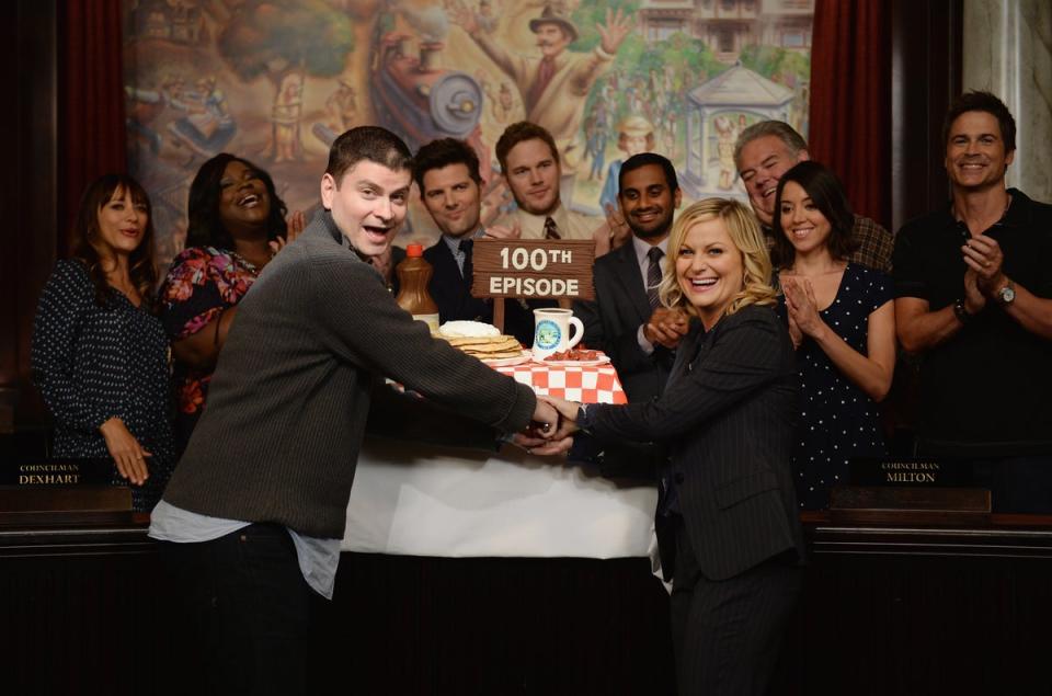 Poehler and Schur, with the cast of ‘Parks and Rec’, celebrating the 100th episode (Getty)