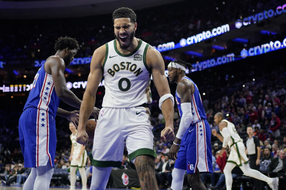 Boston Celtics' Jayson Tatum reacts after a basket during the second half of an NBA basketball game against the Philadelphia 76ers, Wednesday, Nov. 15, 2023, in Philadelphia. (AP Photo/Matt Slocum)