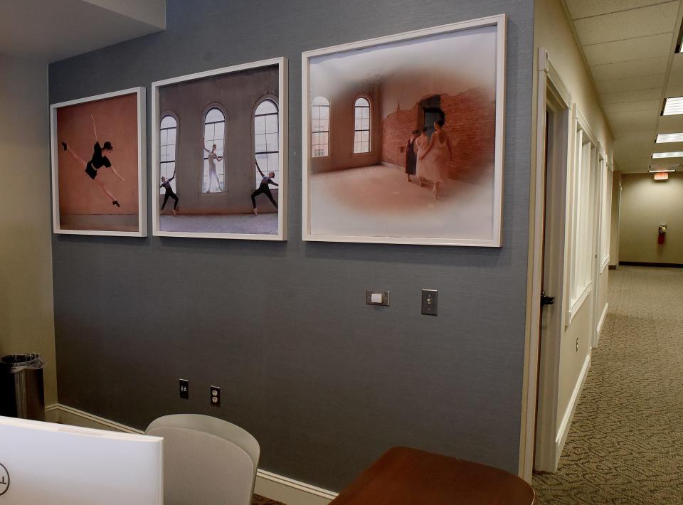 The reception area on the building's first floor is shown. The photos behind the desk feature RRCA dancers and were taken by dance director Gail Choate-Pettit.