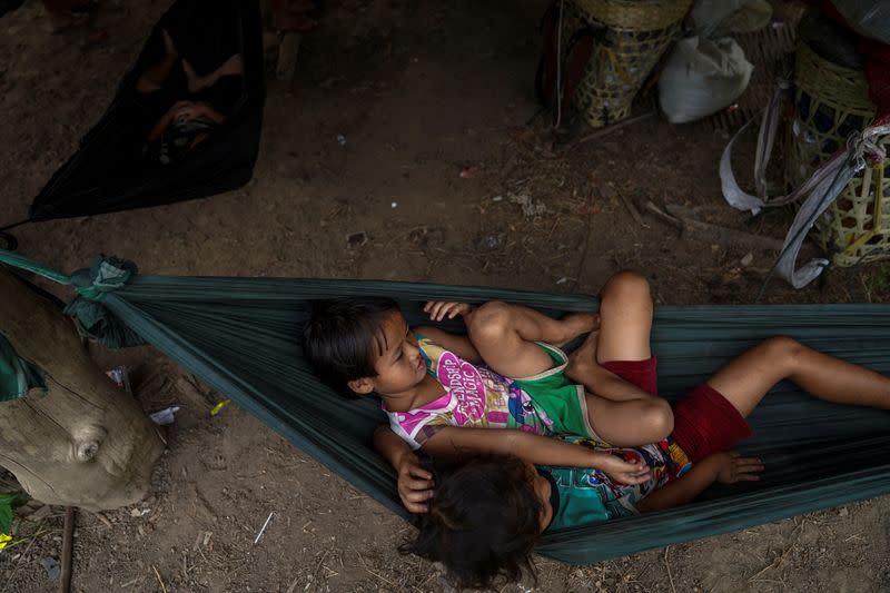 Children sit in a hammock near the Burmese border in Mae Hong Son province