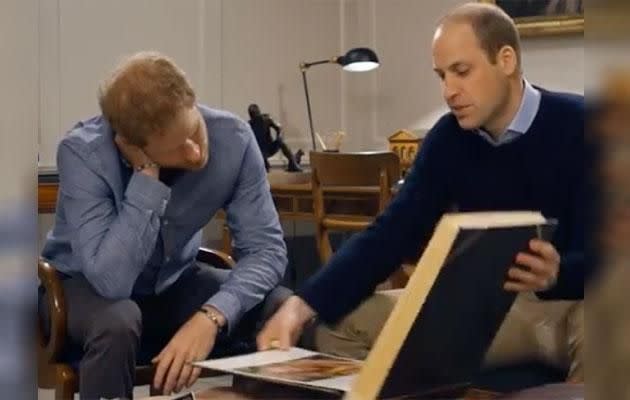 Harry and William look through an old family album. Photo: Instagram