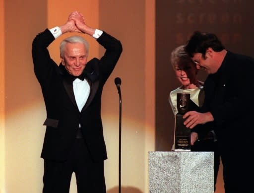 Kirk Douglas receives a Life Achievement Award at the Screen Actors Guild Awards in Los Angeles in March 1999