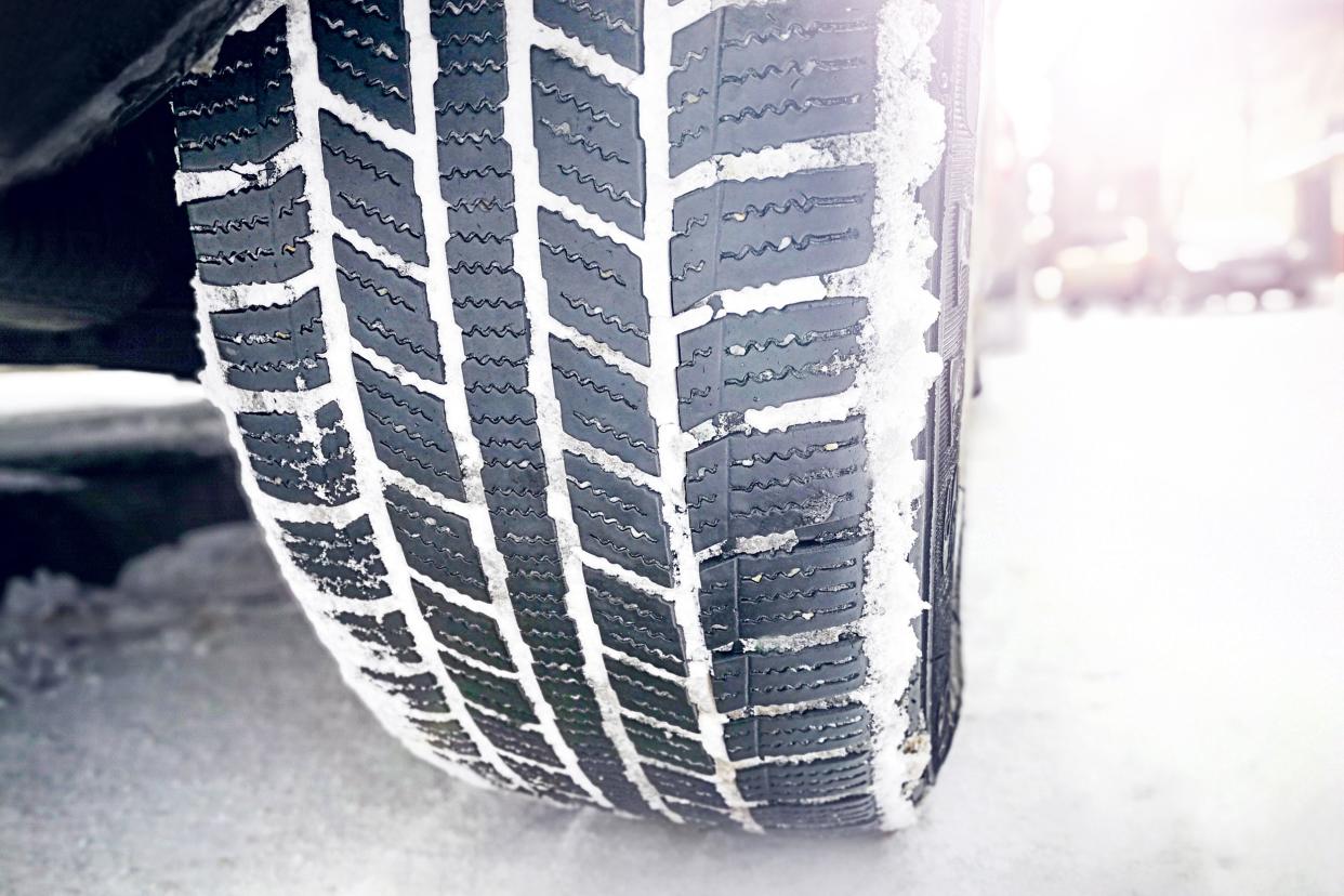 snow tires on snowed winter road