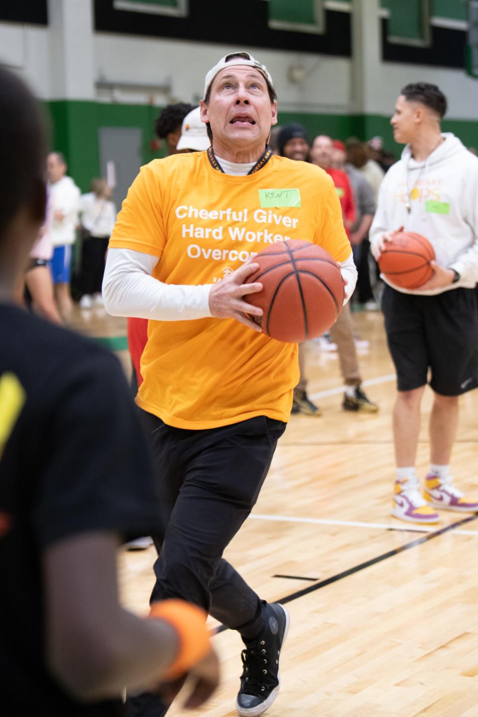 Kent Wellington, one of the original organizers of the Saturday Hoops program, goes up for a shot during the Citywide Knockout Tournament held at Cincinnati State on March 9, 2024. Saturday Hoops is celebrating its 20th anniversary all year long.